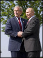 President George W. Bush and President Vladimir Putin of Russia, exchange handshakes Thursday, June 7, 2007, after their meeting at the G8 Summit in Heiligendamm, Germany. White House photo by Eric Draper