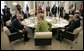 President George W. Bush sits with Chancellor Angela Merkel Thursday, June 7, 2007, prior to the start of the afternoon G8 working session in the G8 Conference Hall at Kempinski Grand Hotel in Heiligendamm, Germany. White House photo by Eric Draper