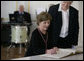 Mrs. Laura Bush signs the Golden Book after arriving at Wismar City Hall in Wismar, Germany Thursday, June 7, 2007, to participate in a program for G8 spouses. Looking on is Dr. Rosemarie Wilcken, Mayor of Wismar. White House photo by Shealah Craighead