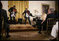 President George W. Bush and guests watch violinists Tourie and Damien Escobar of Nuttin’ But Stringz, as they perform Friday, June 22, 2007 in the East Room of the White House, in celebration of Black Music Month. White House photo by Eric Draper