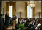 President George W. Bush welcomes guests to the East Room of the White House Friday, June 22, 2007, to join in a celebration of Black Music Month, focusing on the music of hip hop and R &B artists. White House photo by Chris Greenberg