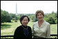 Mrs. Laura Bush and Madame Chi, wife of Vietnam President Nguyen Minh Triet, pose for a photo Friday, June 22, 2007 on the Truman Balcony, during Madame Chi's visit to the White House. White House photo by Chris Greenberg
