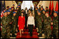 Mrs. Laura Bush and Ms. Mirela Moisiu, daughter of President Alfred Moisiu of Albania, descend a staircase past Albanian troops at the Palace of Brigades in Tirana Sunday, June 10, 2007, during a daylong visit by President and Mrs. Bush. White House photo by Shealah Craighead