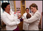 Mrs. Laura Bush holds a newborn at the Wellness Center at Queen Geraldine Hospital for Obstetrics and Gynecology in Tirana, Albania Sunday, June 10, 2007. White House photo by Shealah Craighead