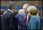 President George W. Bush speaks with Prime Minister Gordon Brown, United Kingdom, and Chancellor Angela Merkel, Germany, during the final day of the G-8 Summit Wednesday, July 9, 2008, in Toyako, Japan. White House photo by Eric Draper