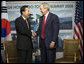 President George W. Bush shakes hands with Republic of Korea President Lee Myung-bak following their meeting at the G-8 Summit Wednesday, July 9, 2008, in Toyako, Japan. White House photo by Eric Draper