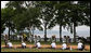 Mrs. Laura Bush, joined by other G-8 spouses, plants a tree at the Toyako New Mount Showa Memorial Park during tree planting ceremony Wednesday, July 9, 2008, in Hokkaido, Japan. Joining Mrs. Bush from left are Mrs. Sarah Brown, spouse of the Prime Minister of the United Kingdom, Mrs. Svetlana Medvedev, spouse of the President of Russia, Mrs. Laureen Harper, spouse of the Prime Minister of Canada, Mrs. Kiyoko Fukuda, spouse of the Prime Minister of Japan, and Ms. Harumi Takahashi, Governor of Hokkaido. White House photo by Shealah Craighead