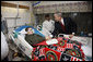 President George W. Bush shakes hands with U.S. Marine Corps Lance Cpl. Justin Rokohl of Orange Grove, Texas, Thursday, July 3, 2008, after awarding Rokohl with a Purple Heart and citation at the National Naval Medical Center in Bethesda, Md. Rokohl's father, John, is seen background. White House photo by Eric Draper