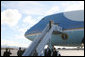 President George W. Bush and Laura Bush wave as they depart Honolulu, Hawaii, Tuesday, Nov. 21, 2006, for their flight home to Washington, D.C., following their eight-day trip to Asia. White House photo by Paul Morse