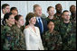 President George W. Bush and Laura Bush pose for photos with military personnel during a breakfast Tuesday, Nov. 21, 2006, at the Officers Club at Hickam Air Force Base in Honolulu, Hawaii. White House photo by Eric Draper