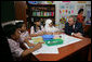 President George W. Bush talks with students at Papandaya Public Elementary School in Bogor Palace, Indonesia, Monday, Nov. 20, 2006. White House photo by Shealah Craighead
