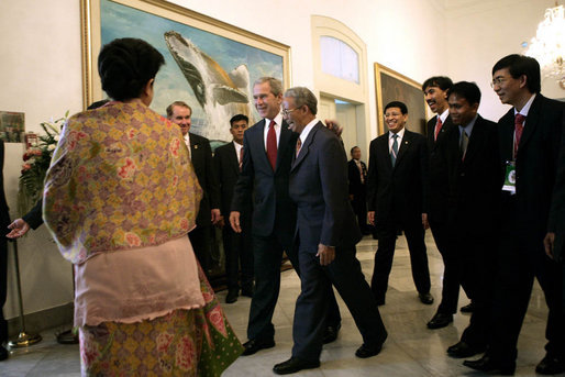 President George W. Bush greets participants as he heads to a roundtable discussion Monday, Nov. 20, 2006, at the Bogor Palace in Bogor, Indonesia. White House photo by Eric Draper