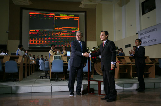 President George W. Bush shakes hands with Tran Dac Sinh, CEO of Securities Trading Center in Ho Chi Minh City during a tour Monday, Nov. 20, 2006, of the Securities Trading Center. White House photo by Paul Morse
