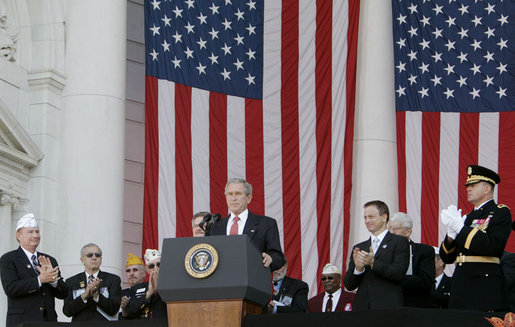 President George W. Bush is applauded as he addresses the Veteran’s Day ceremonies Saturday, Nov. 11, 2006, at Arlington National Cemetery in Arlington, Va. White House photo by Kimberlee Hewitt