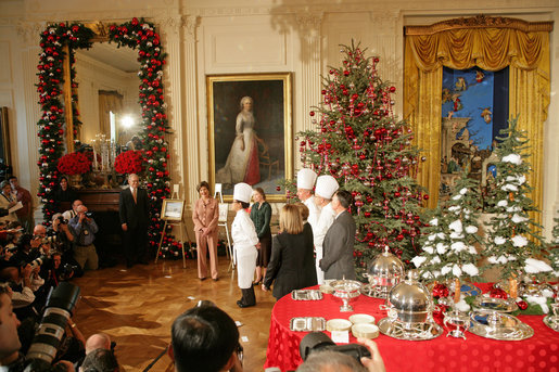 Mrs. Laura Bush and White House Chef Cris Comerford, center, explain the holiday reception menu to the press in the State Dining Room Thursday, Nov. 30, 2006. White House photo by Shealah Craighead