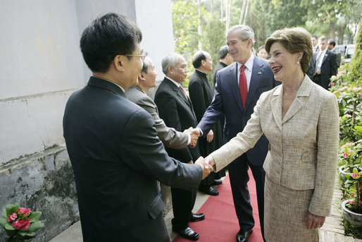 Mrs. Laura Bush is greeted as she and President George W. Bush arrive for church services Sunday, Nov. 19, 2006, at Cua Bac Church in Hanoi. White House photo by Eric Draper