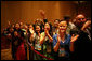 Staff and family members of the U.S. Embassy in Hanoi give an enthusiastic greeting to President George W. Bush as he arrives Saturday, Nov. 18, 2006, at the Sheraton Hanoi after meeting with Southeast Asian leaders. White House photo by Paul Morse