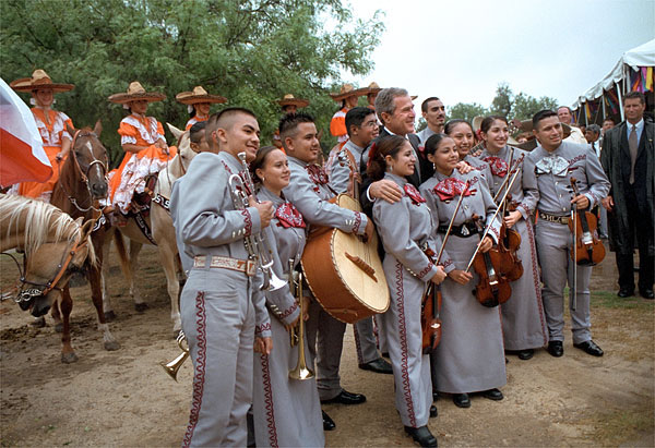 President Bush poses for photos with a mariachi band during the dedication ceremony of the San Antonio Missions National Historical Park in San Antonio, Texas, Aug. 29. White House photo by Moreen Ishikawa.