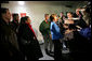 Laura Bush flanked by members of the U.S. Olympic Delegation, (from left) Roland Betts, Dr. Debi Thomas, Herschel Walker and Dr. Eric Heiden meet with members of the press after watching the Men’s U.S. Speed Skating competition at the 2006 Winter Olympics in Turin, Italy. White House photo by Shealah Craighead