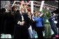 Laura Bush, her daughter, Barbara, and members of the U.S. Olympic Delegation, cheer on American Speed Skater Chad Hedrick Saturday, Feb. 11, 2006, during his heat at the 2006 U.S. Winter Olympics, in Turin, Italy. Hedrick went on to win the first gold medal for the United States. White House photo by Shealah Craighead