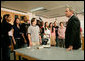 President George W. Bush speaks with science and engineering students after touring the Yvonne A. Ewell Townview Magnet Center in Dallas, Texas, Friday, Feb. 3, 2006. White House photo by Eric Draper