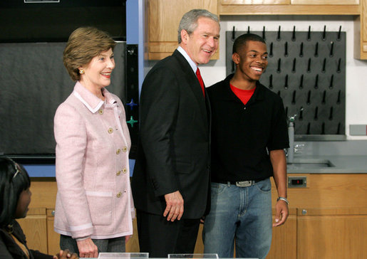President George W. Bush and Mrs. Laura Bush greet student Michael Harrell during a visit with science and engineering students at the Yvonne A. Ewell Townview Magnet Center in Dallas, Texas, Friday, Feb. 3, 2006. White House photo by Eric Draper