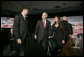 President George W. Bush speaks with participants Justin Sanchez, left, and Nicole Lopez after a panel on American competitiveness Friday, Feb. 3, 2006, at Intel Corporation in Rio Rancho, N.M. White House photo by Eric Draper