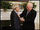 Vice President Dick Cheney presents the Distinguished Service Cross to Lieutenant Bernard W. Bail in the Roosevelt Room at the White House, Friday, February 24, 2006. The Distinguished Service Cross is awarded to a person who while serving in any capacity with the U.S. Army distinguished himself or herself by extraordinary heroism. After Lt. Bail’s aircraft took heavy anti-aircraft fire that killed the pilot and wounded other crew members over the English Channel on June 5, 1944, Lt. Bail displayed such acts of valor and ultimately prevented the aircraft, loaded with a full ordnance, from crashing into an English village. White House photo by David Bohrer