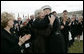 Joyce Rumsfeld, wife of Secretary of Defense Donald Rumsfeld, embraces General Peter Pace, Chairman of the Joint Chiefs of Staff, after she was presented with a medal in recognition of her service Friday, Dec. 15, 2006, during an Armed Forces Full Honor Review in honor of her husband. Mrs. Lynne Cheney looks on at left. White House photo by Eric Draper