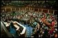 Congress applauds President Bush during his State of the Union Address at the U.S. Capitol Tuesday Jan. 28, 2003. Discussing the spread of the AIDS virus, President Bush asked Congress to commit $15 billion in aid for African nations and the Caribbean tormented by the disease. “The qualities of courage and compassion that we strive for in America also determine our conduct abroad,” said the President. “This conviction leads us into the world to help the afflicted, and defend the peace, and confound the designs of evil men.” White House photo by Paul Morse