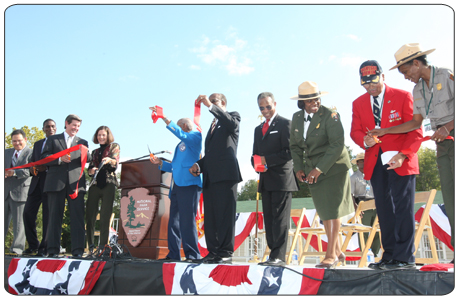 At the grand opening of the Tuskegee Airmen National Historic Site on October 10, 2008, Deputy Secretary of the Interior Lynn Scarlett cut the ribbon to open the new site, joining Alabama Governor Bob Riley and some of those whom the new national park site honors—the first African-American military aviators, who served with distinction in World War II.