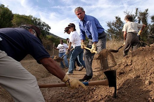 Working alongside volunteers, President George W. Bush lends a hand in repairing the Old Boney Trail at the Santa Monica Mountains National Recreation Area in Thousand Oaks, Calif. File photo. White House photo by Paul Morse.