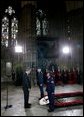 President George W. Bush bows his head in silence as a wreath is laid at the Tomb of the Unknown Warrior at Westminster Abbey in London Thursday, Nov. 20, 2003. White House photo by Eric Draper.