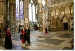 Walking with Dr. Wesley Clark, President George W. Bush tours Westminster Abbey Thursday, Nov. 20, 2003. Mrs. Bush is also pictured.  White House photo by Eric Draper