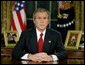 President George W. Bush addresses the nation from the Oval Office at the White House Wednesday evening, March 19, 2003. White House photo by Paul Morse