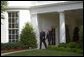 President George W. Bush and Prime Minister Tony Blair of the United Kingdom wave to the press from the Oval Office Wednesday, May 17, 2007. White House photo by Joyce Boghosian