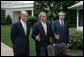 President George W. Bush, center, joined by Homeland Security Secretary Michael Chertoff, left, and Commerce Secretary Carlos Gutierrez, right, makes a statement on immigration reform Thursday, May 17, 2007 on the South Lawn of the White House. "I want to thank the members of the Senate who worked hard, said President Bush. "I appreciate the leadership shown on both sides of the aisle. As I reflect upon this important accomplishment, important first step toward a comprehensive immigration bill, it reminds me of how much the Americans appreciate the fact that we can work together -- when we work together they see positive things." White House photo by Joyce Boghosian