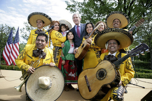 President George W. Bush poses with members of the Los Hermanos Mora Arriaga mariachi band, who performed in the Rose Garden at the White House Friday, May 4, 2007, during a celebration of Cinco de Mayo. White House photo by Eric Draper