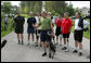 President George W. Bush stands with member of the President's Council on Physical Fitness and Sports as he addresses the press before a bike ride in Beltsville, Md., Saturday, May 5 , 2007. "Today I'm going to ride with a group of friends on a mountain bike," said the President in his remarks about May being Physical Fitness Month, "But the message to all Americans is to find time in your schedule to walk, run, swim, bike, to take care of yourselves." White House photo by Joyce Boghosian