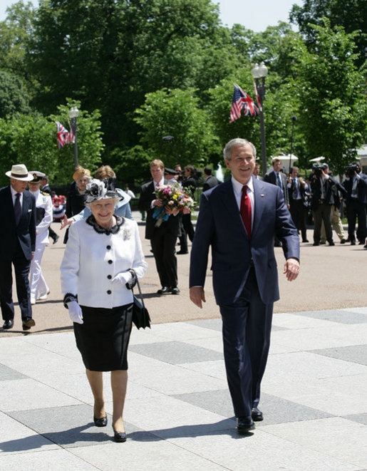 President George W. Bush escorts Her Majesty Queen Elizabeth II of Great Britain on a walk from the White House to Blair House Monday, May 7, 2007, where Queen Elizabeth II and His Royal Highness the Prince Philip, Duke of Edinburgh, are staying during their visit to Washington, D.C. White House photo by Eric Draper
