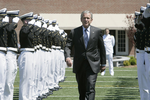 President George W. Bush is saluted by an honor cordon of U.S. Coast Guard cadets on his arrival to address the graduates Wednesday, May 23, 2007, at the U.S. Coast Guard Academy commencement in New London, Conn. White House photo by Joyce Boghosian