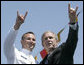 President George W. Bush and U.S. Coast Guard graduate Brian Robert Staudt offer the Texas Longhorns hand sign out to the audience following the President’s address to the graduates Wednesday, May 23, 2007, at the U.S. Coast Guard Academy commencement in New London, Conn. White House photo by Joyce Boghosian