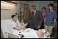 President George W. Bush shakes the hand of Cpl. Ryan T. Dion of Manchester, Conn., after awarding him a Purple Heart Thursday, May 25, 2007, during a visit to the National Naval Medical Center in Bethesda, Md., where the Marine is recovering from wounds received in Operation Iraqi Freedom. With them are Cpl. Dion's parents, Thomas and Patricia Dion, and brother, Justin. White House photo by Joyce Boghosian