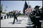 President George W. Bush salutes the color guard as he arrives at the annual Peace Officers’ Memorial Service outside the U.S. Capitol Tuesday, May 15, 2007, paying tribute to law enforcement officers who were killed in the line of duty during the previous year and their families. White House photo by Joyce Boghosian