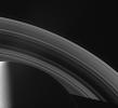 The Cassini spacecraft looks across Saturn's cloud-dotted north and shadowed pole, and out across the lanes of ice that compose its rings