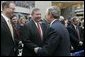 President George W. Bush greets former Attorney General John Ashcroft after the swearing-in ceremony Thursday, March 3, 2005, of Michael Chertoff as new Homeland Security chief. The event took place at the Ronald Reagan Building and International Trade Center in Washington, D.C. White House photo by Paul Morse