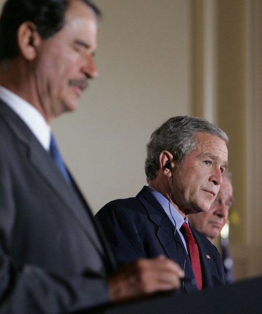 President George W. Bush participates in a March 23, 2005, joint news conference with Mexican President Vicente Fox, left, and Canadian Prime Minister Paul Martin, right, at Baylor University in Waco, Texas. "It's important for us to work to make sure our countries are safe and secure, in order that our people can live in peace, as well as our economies can grow," said President Bush. White House photo by Krisanne Johnson White House photo by Krisanne Johnson