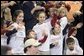 Wearing matching T-shirts, a group of future retirees wave during the President's visit to Shreveport, La., Friday, March 11, 2005. White House photo by Paul Morse