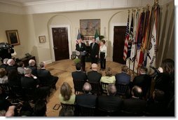 Irish Taoiseach Bertie Ahern delivers remarks before presenting President George W. Bush with the traditional bowl of shamrocks during a St. Patrick's Day Shamrock Ceremony in the Roosevelt Room Thursday, March 17, 2005.  White House photo by Paul Morse