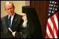 President George W. Bush listens as Archbishop Demetrios Trakatellis delivers brief remarks Monday, March 28, 2005, during a celebration of Greek Independence Day at the Eisenhower Executive Office Building in Washington DC.White House photo by Krisanne Johnson